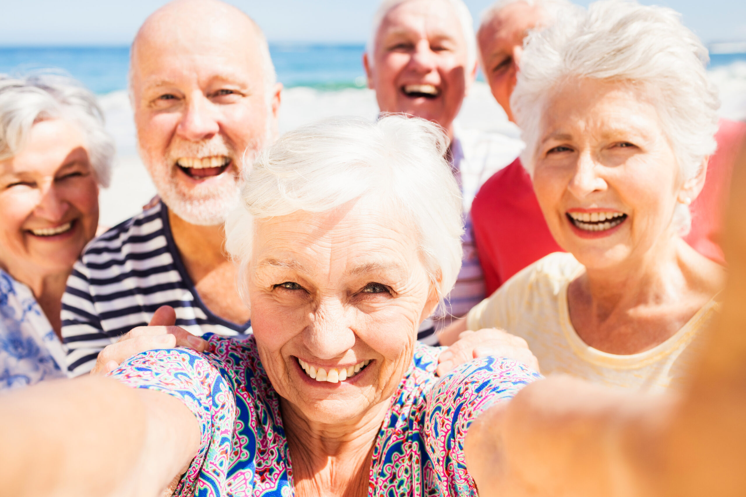 senior friends taking selfie